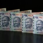 Rupee declines 16 paise to settle at 86.56 against U.S. dollar