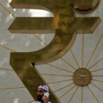 Rupee falls 6 paise to 87.69 against U.S. dollar in early trade