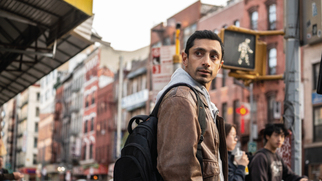 ‘Relay’ movie review: Riz Ahmed is the silky center of this throwback thriller