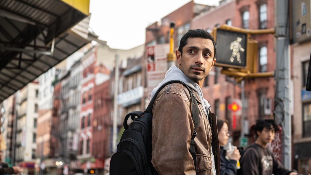 ‘Relay’ movie review: Riz Ahmed is the silky center of this throwback thriller