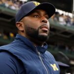Former Michigan coach Jim Harbaugh reacts to Sherrone Moore’s shocking firing and criminal charges