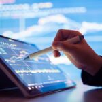 Stock markets end marginally higher after volatile day of trading